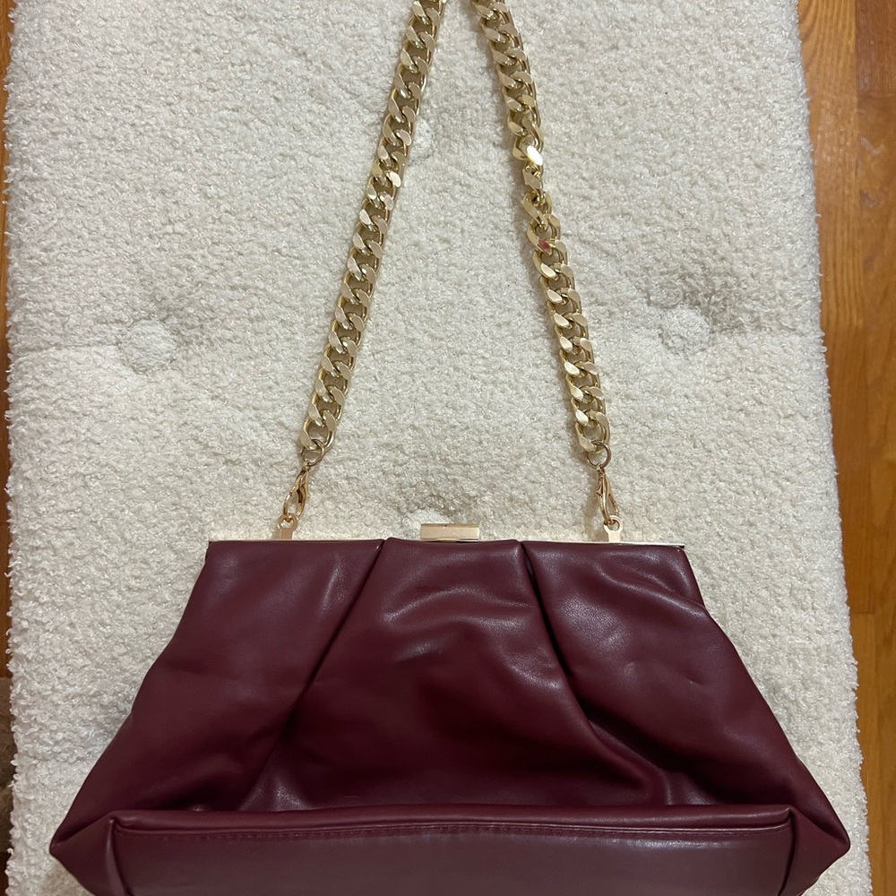 Elegant Burgundy Leather Handbag with Gold Chain